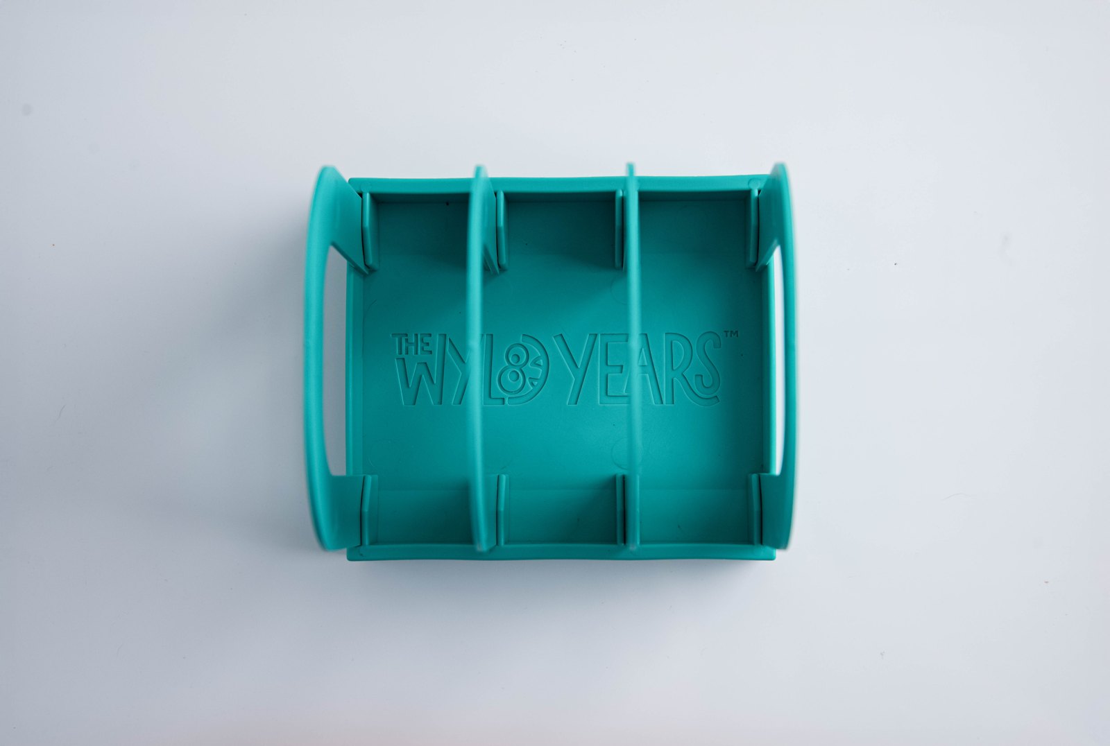 Top-down view of Mylk Mate showing The Wyld Years logo on the base